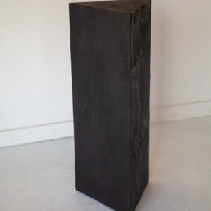 black plaster triangle pedestal table