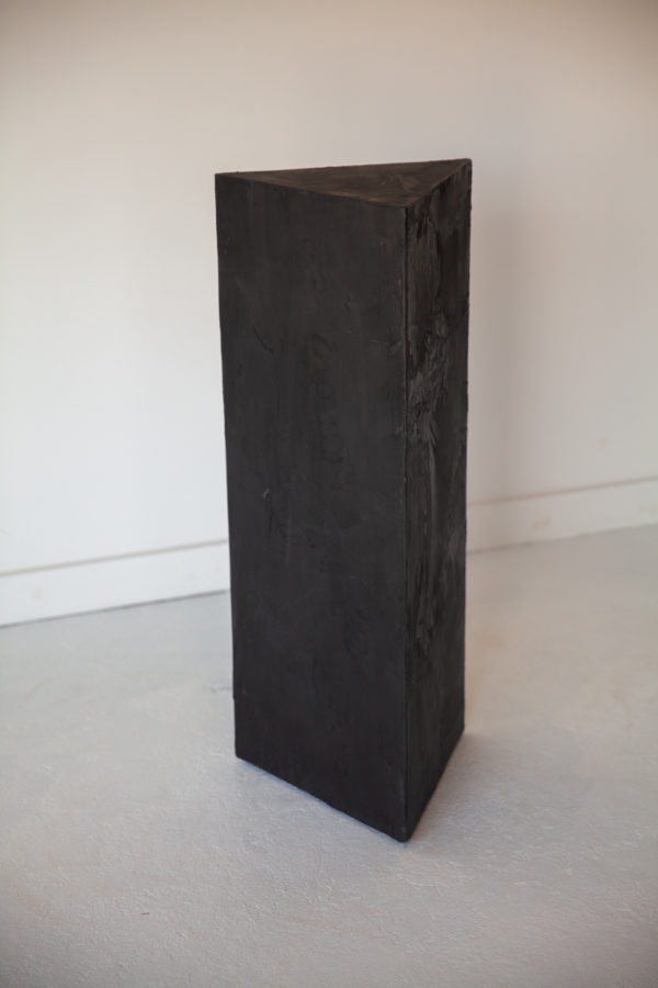 black plaster triangle pedestal table